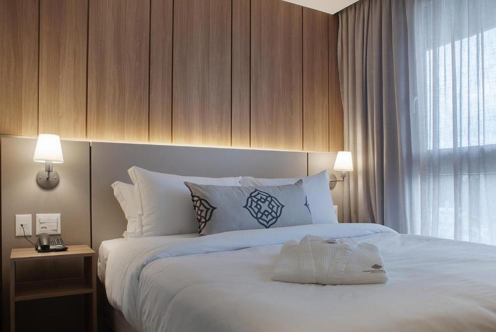 Quarto de hotel em Gramado com cama